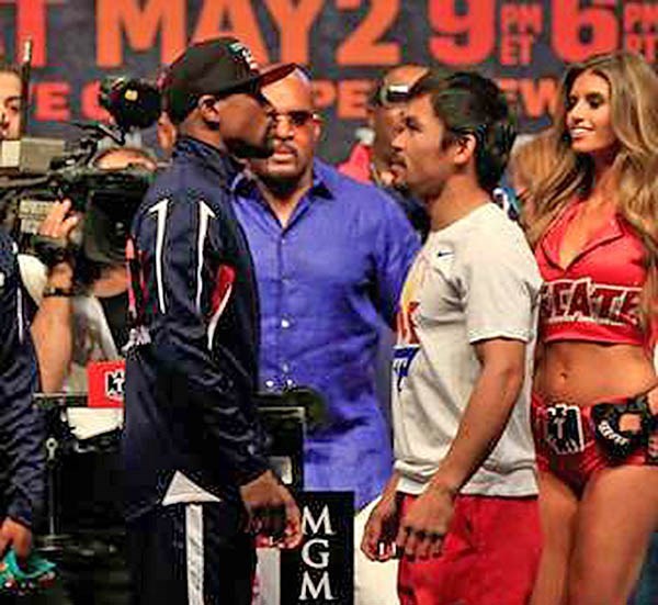 Floyd y Manny, cara a cara en el pesaje de ayer. Ambos dieron el peso y están listos para subir hoy al ring.